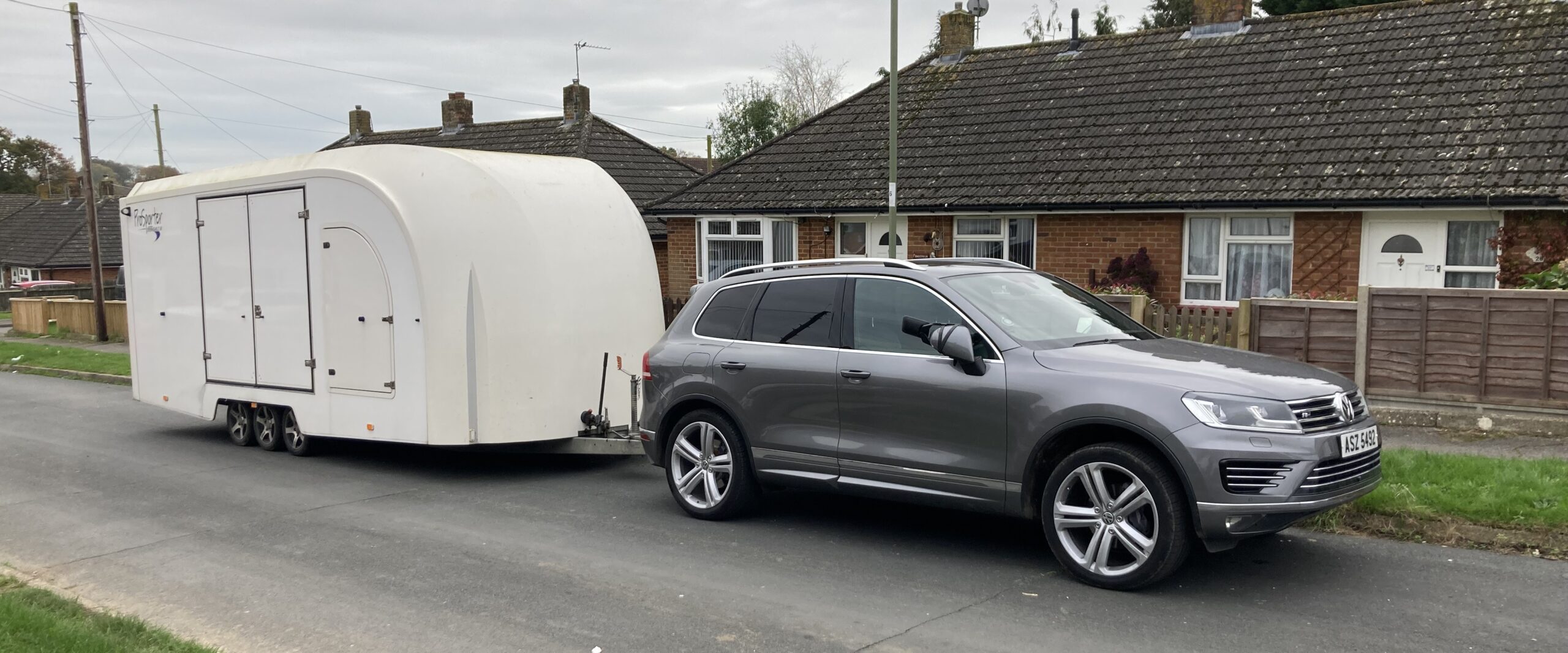 Volkswagon Tourag and covered trailer
